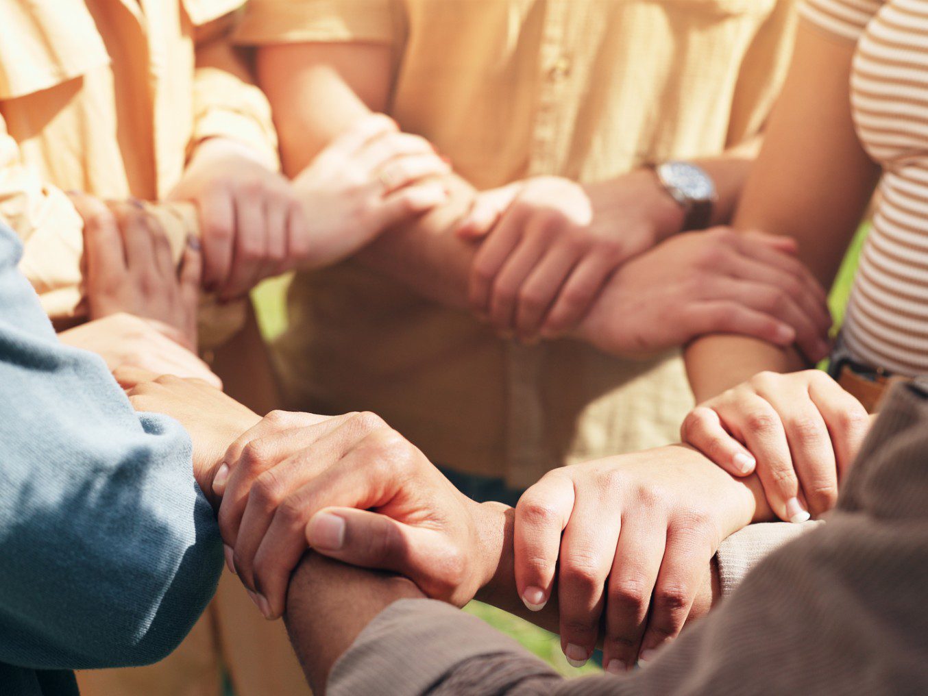 Diverse hands joined in solidarity